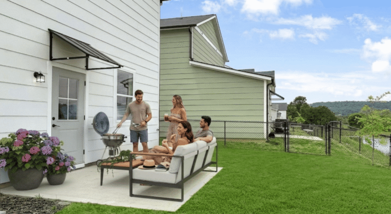 Residents gathered on a back patio overlooking the fenced yard at Highline at Knoxville