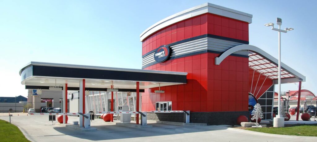 The same Tommy&rsquo;s Express format from the entry side, showing the pay lanes beneath the canopy